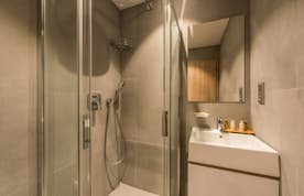 Modern bathroom walk-in shower family apartment Iroko Morzine