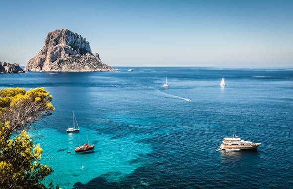 The boats are in the water in Ibiza. 