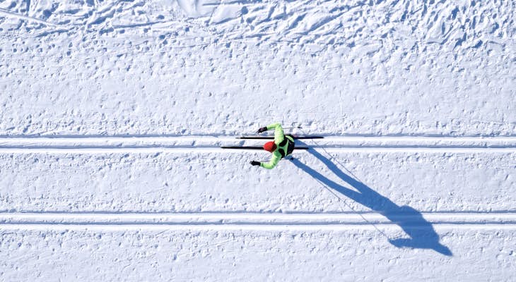 An aerial view of a skier in the snow.