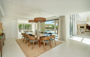 Saint-Tropez - 3 Les Carroz d’Araches accommodation - Villa Milasand - Dining room with table, chairs and hanging lamps