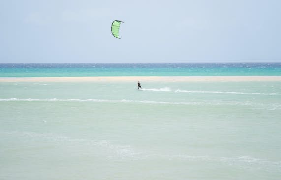 A person is kitesurfing 