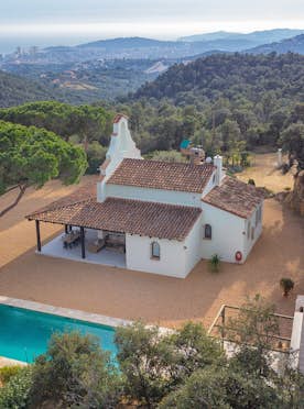 Costa Brava accommodation - La Capella - A house with a pool in the middle of a forest.