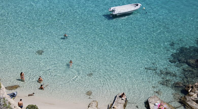 A beach with rocks and a rocky shore.