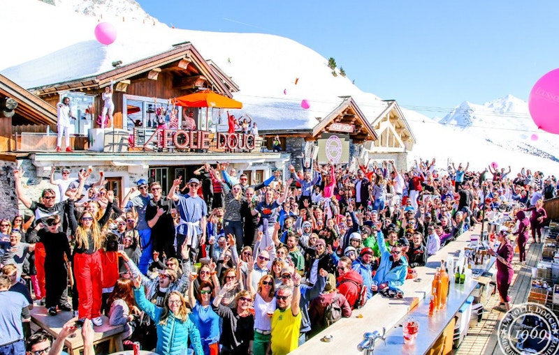 People partying at an apres ski party during skiing holidays in French Alps