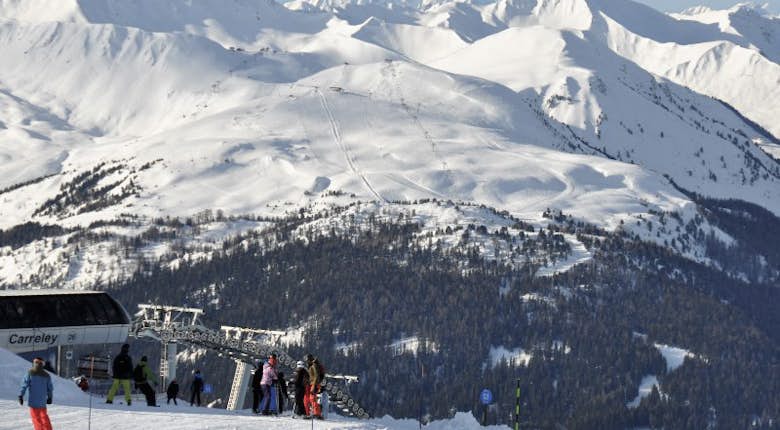 Skiing through forests in La Plagne 