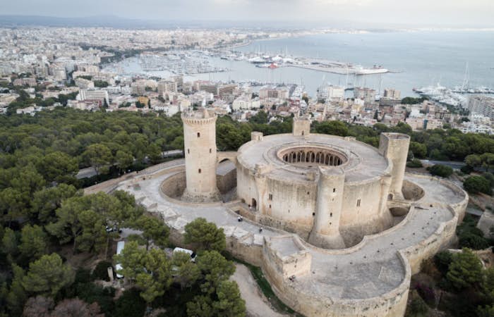 Visit Bellver Castle overlooking Palma de Mallorca