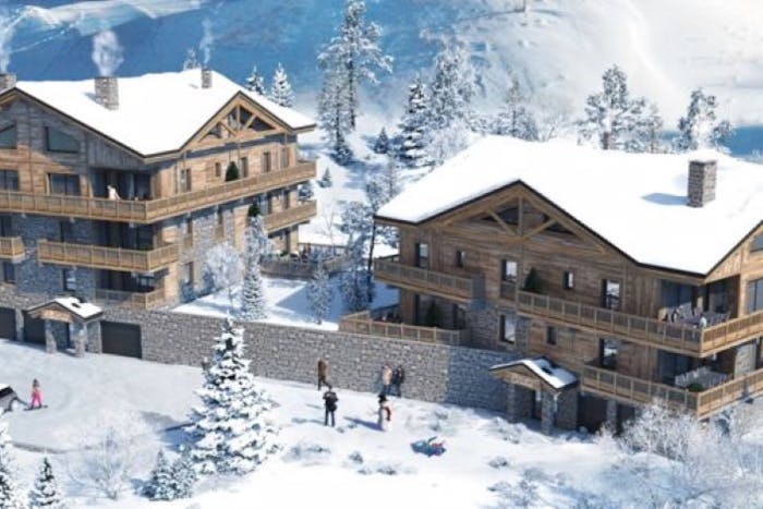 Snowed facade Les Chalets du Golf development Alpe d'Huez