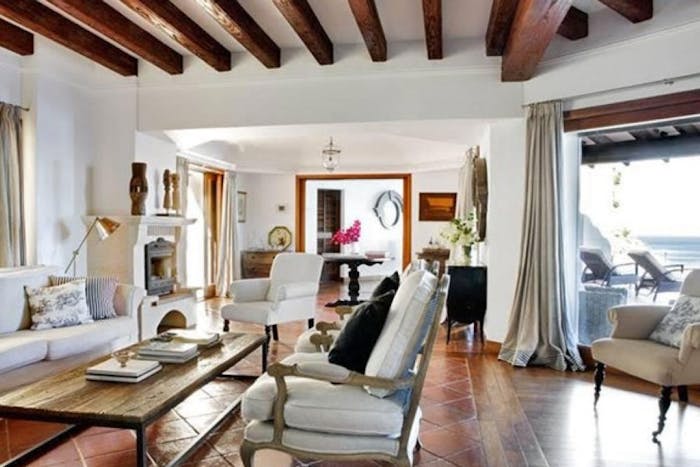 Cozy living room with fireplace at Villa El Ensueño in Calella de Palafrugell