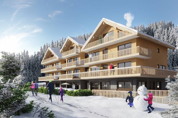 Snowy facade ski-in-ski-out building Les Carroz d'Araches