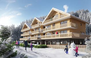 Les Carroz d’Araches accommodation - L’Estellan - Snowy facade ski-in-ski-out building Les Carroz d'Araches