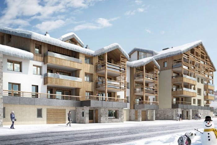 Snowed facade Les Fermes de l'Alpe building Alpe d'Huez