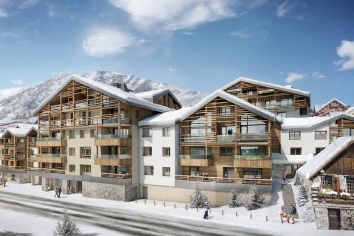 Snowed facade Les Fermes de l'Alpe building Alpe d'Huez
