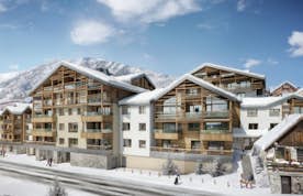 Alpe d’Huez location - Les Fermes de l'Alpe - Snowed facade Les Fermes de l'Alpe building Alpe d'Huez
